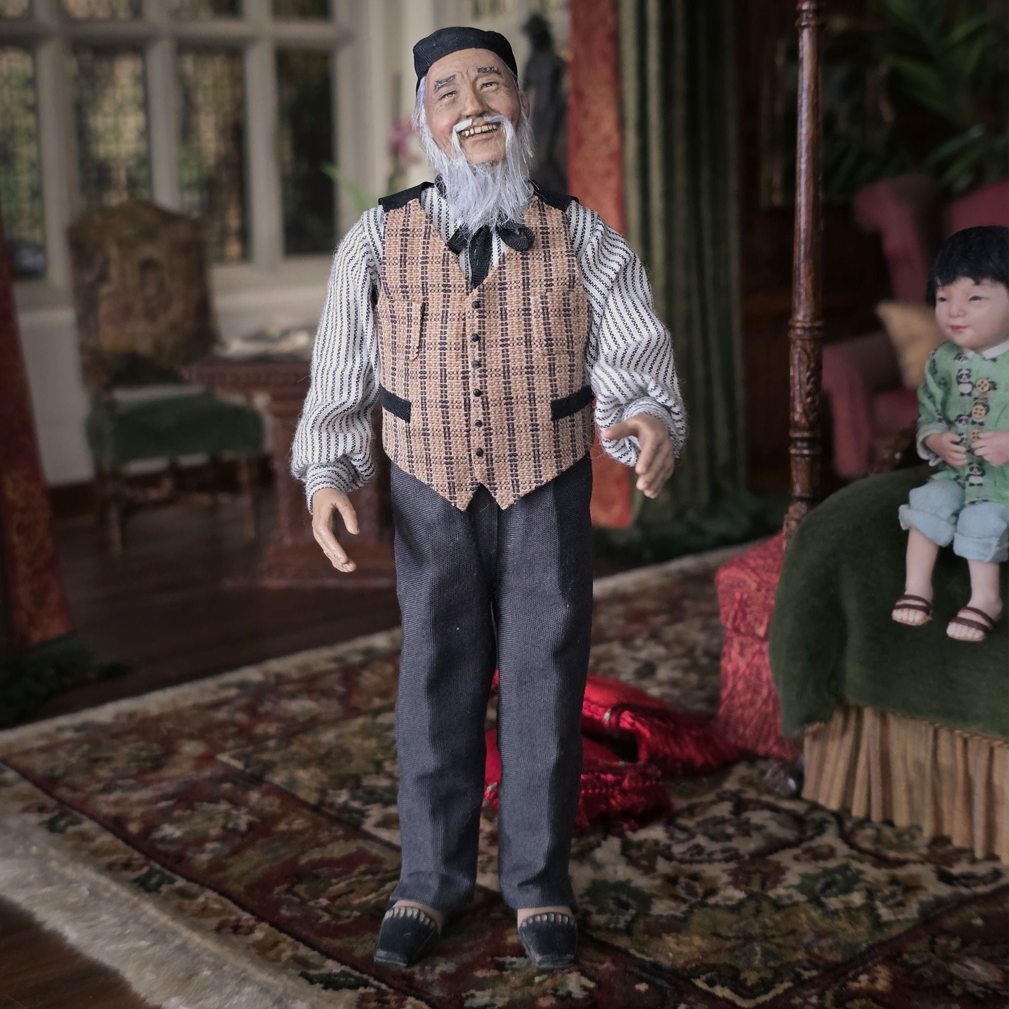 Dollhouse scene with an elderly man and a child in a living room setting.