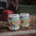 Load image into Gallery viewer, Decorative porcelain garden seats with colorful designs, shown on a patterned rug.
