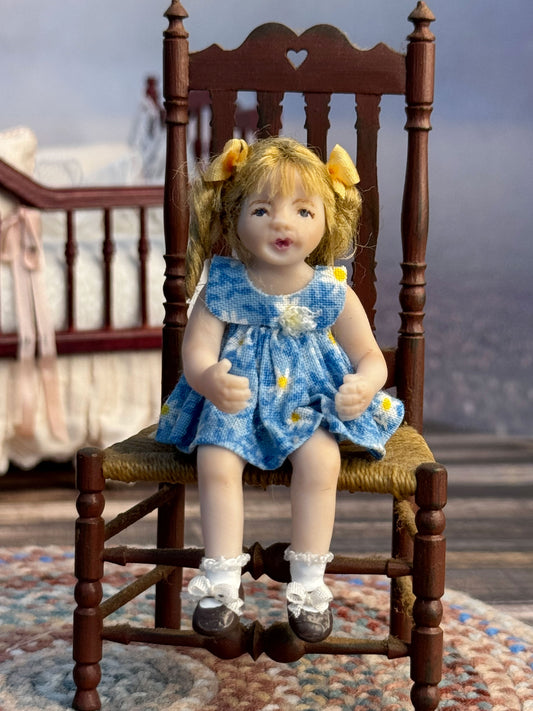 Bonnie Justice Sculpted Seated Little Blonde Girl Doll in Blue Dress, sitting in chair