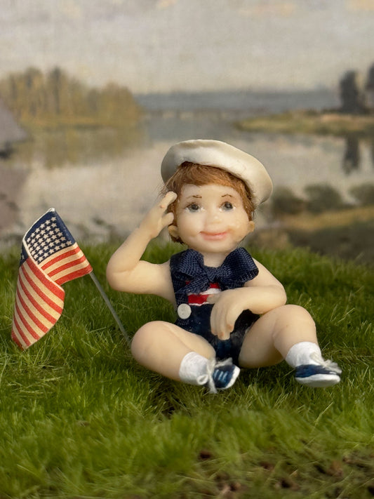 Saluting Patriotic Seated Little Boy Toddler Doll w Flag, front