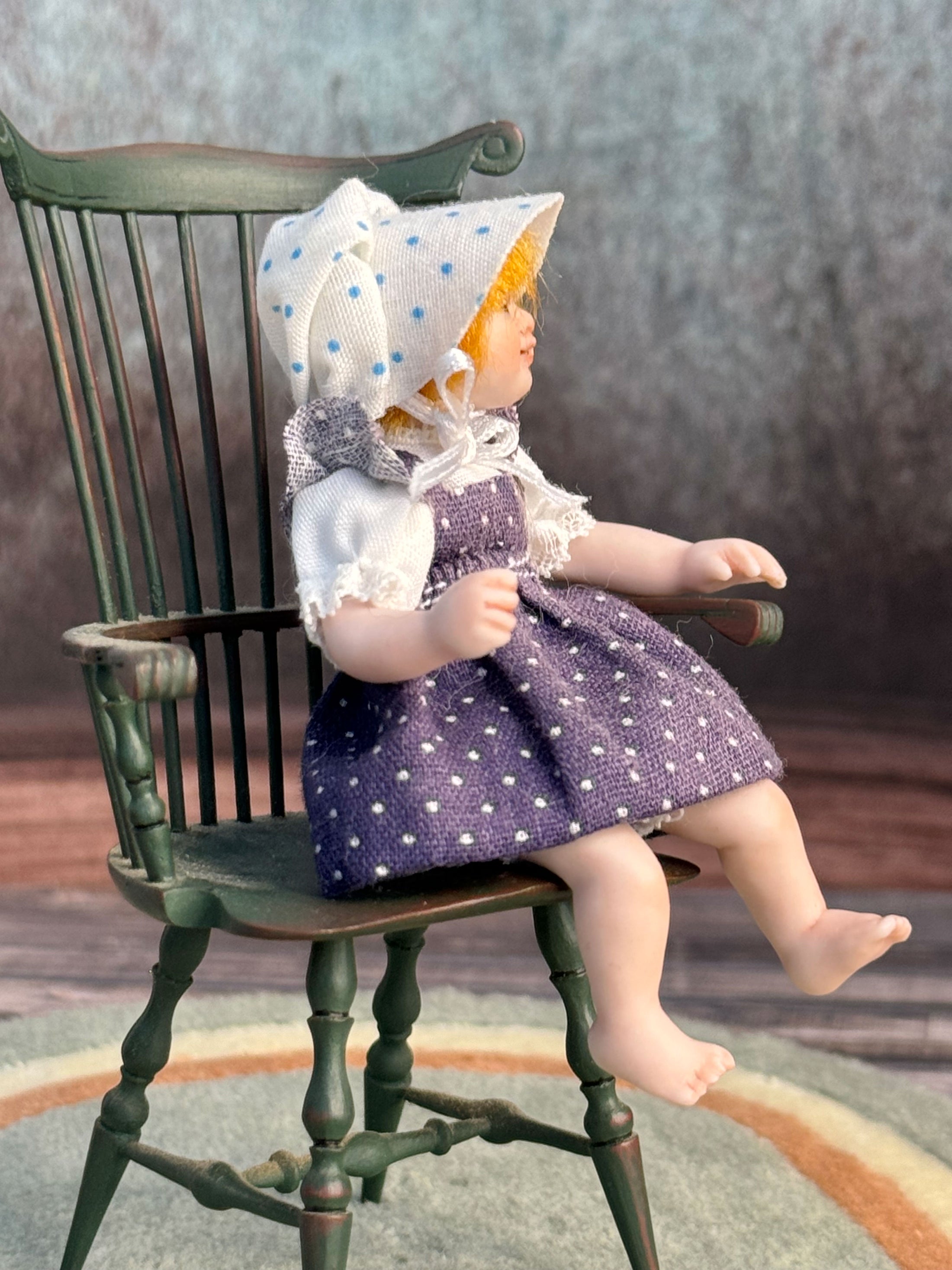 Sculpted Porcelain Red Head Primitive Young Girl Doll, Jointed, seated in a chair, right side