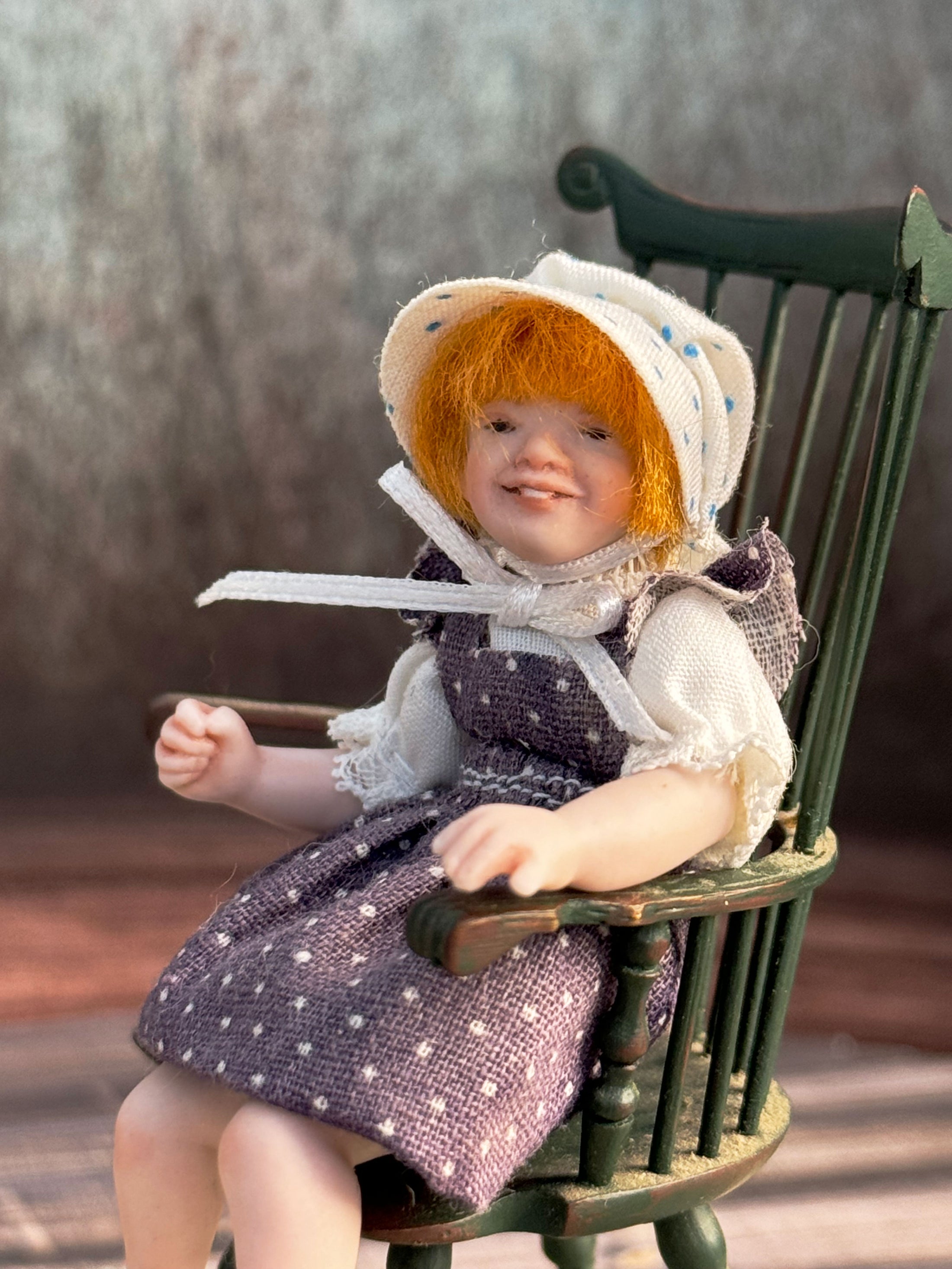 Sculpted Porcelain Red Head Primitive Young Girl Doll, Jointed, seated in a chair, left side