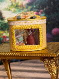 Load image into Gallery viewer, Miniature Dollhouse Yellow Silk Victorian Hatbox with Diorama Hat Shop Scene Inside, front
