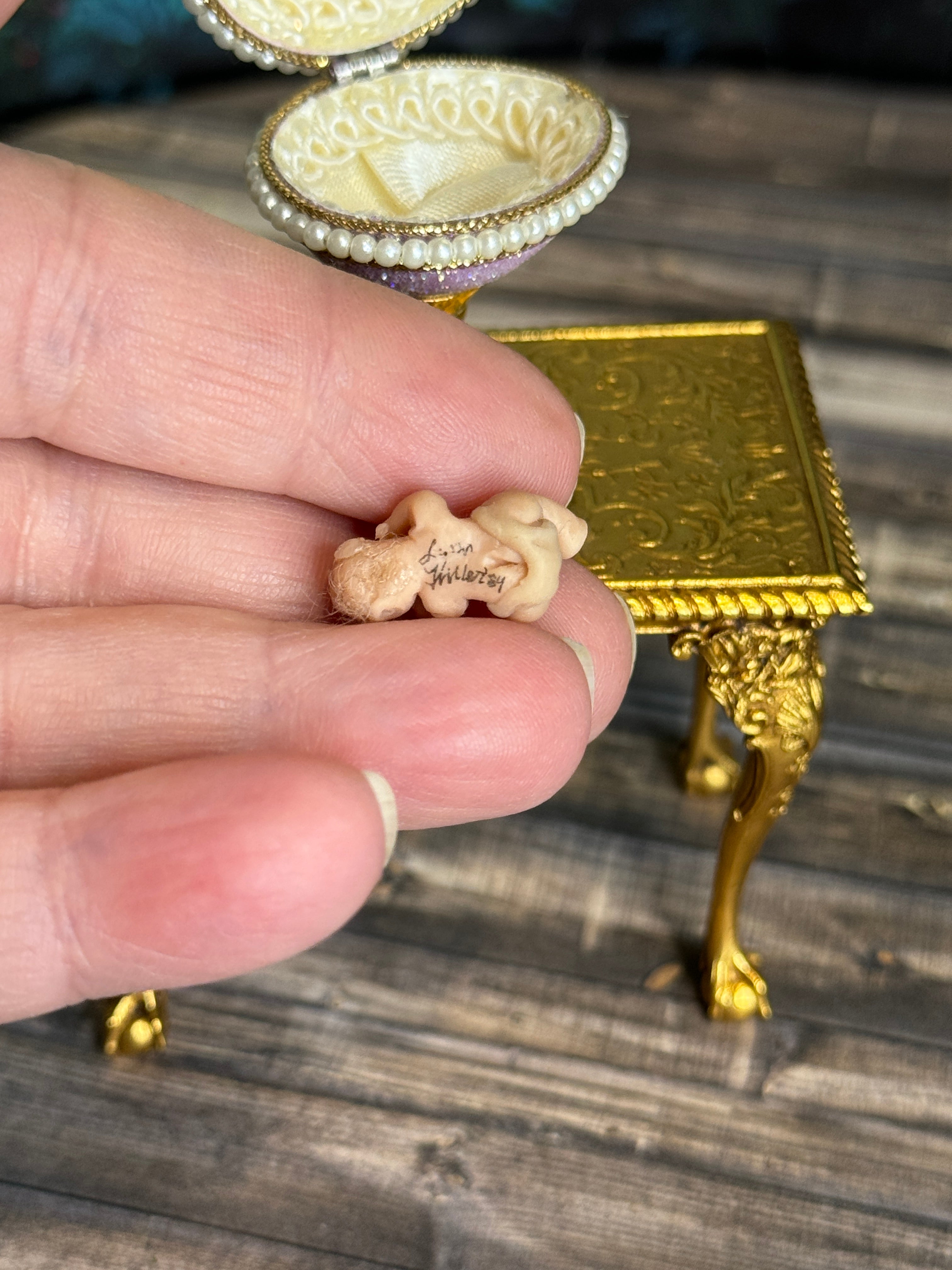 Artisan Signed, 'Hiller' sculpted vintage miniature baby, in hand, backside