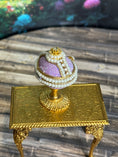 Load image into Gallery viewer, Artisan Signed, 'Hiller' sculpted vintage miniature baby in glittered footed pink egg stand, top view, closed
