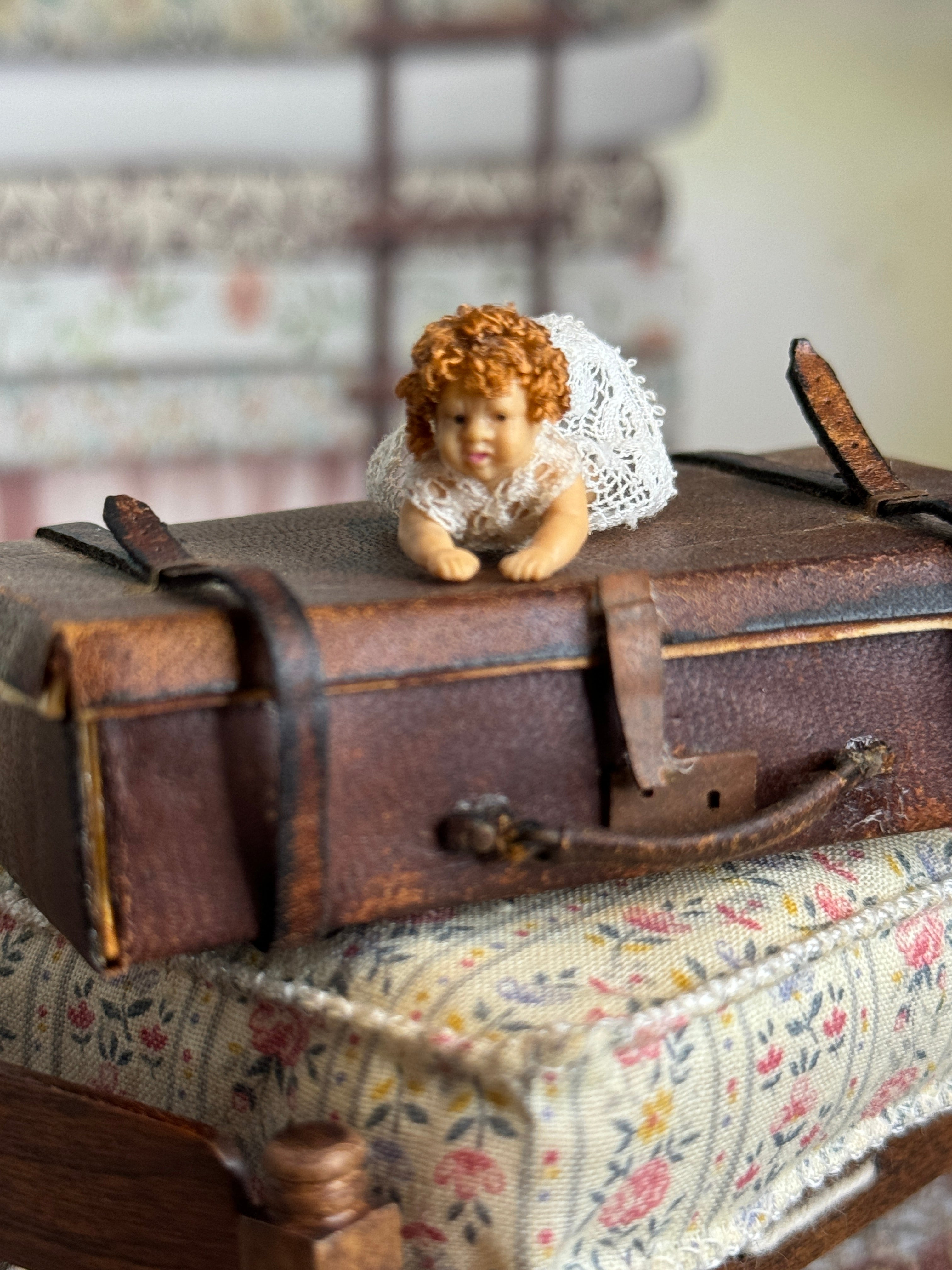 Curly Haired Tummy-Laying Sculpted Rubber Baby Girl Doll, front view