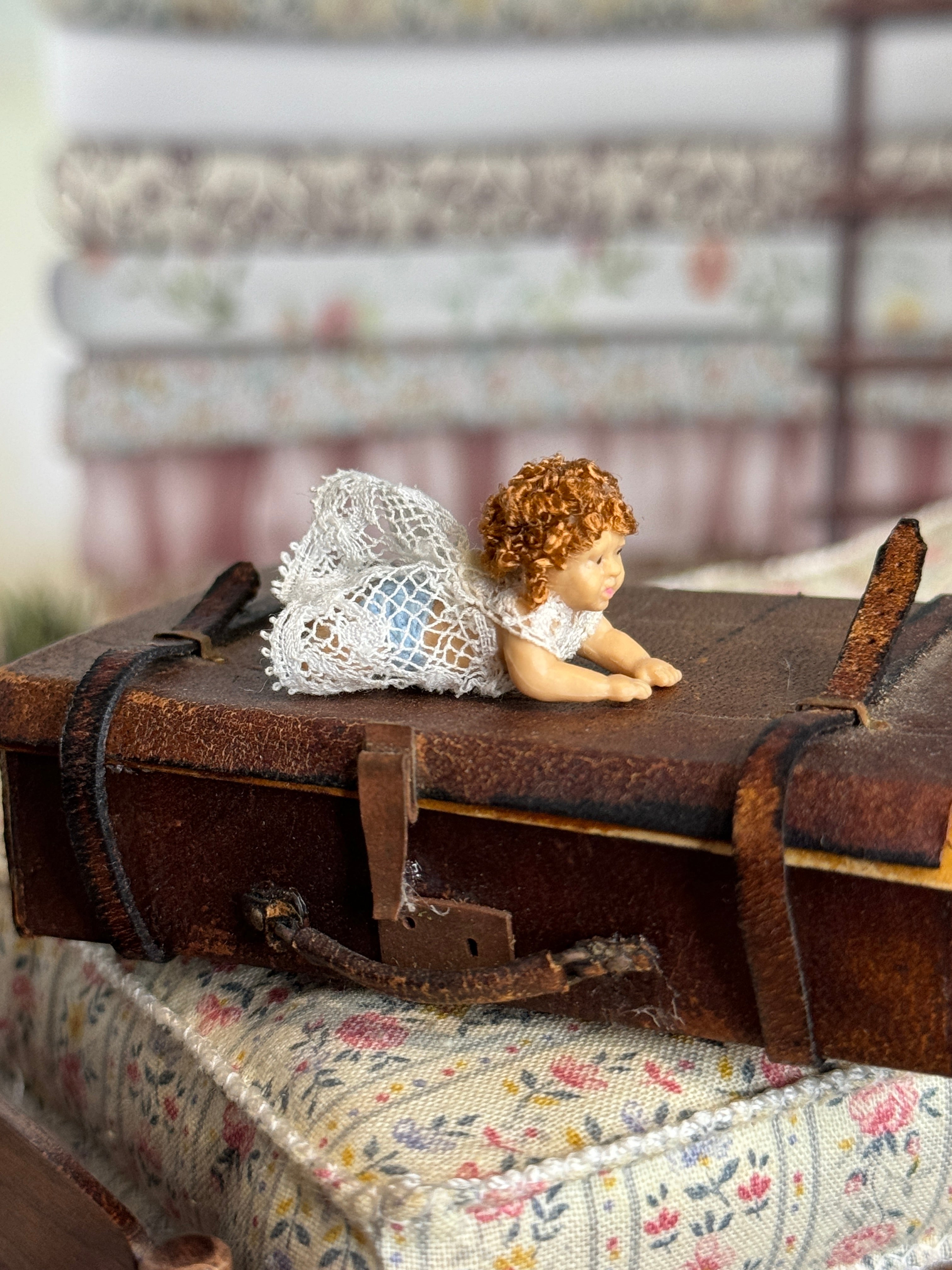 Curly Haired Tummy-Laying Sculpted Rubber Baby Girl Doll, side view 2