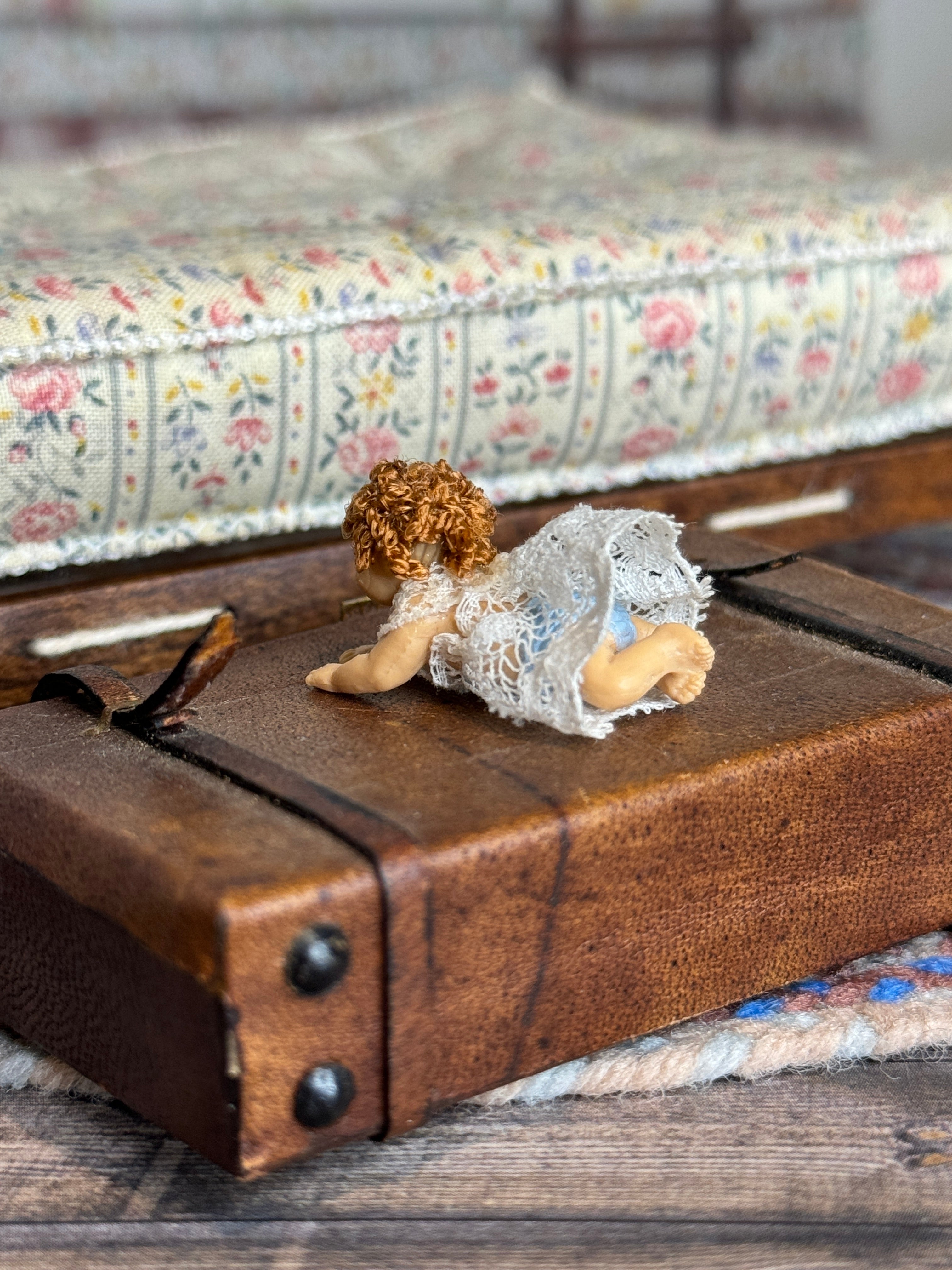 Curly Haired Tummy-Laying Sculpted Rubber Baby Girl Doll, side view 3