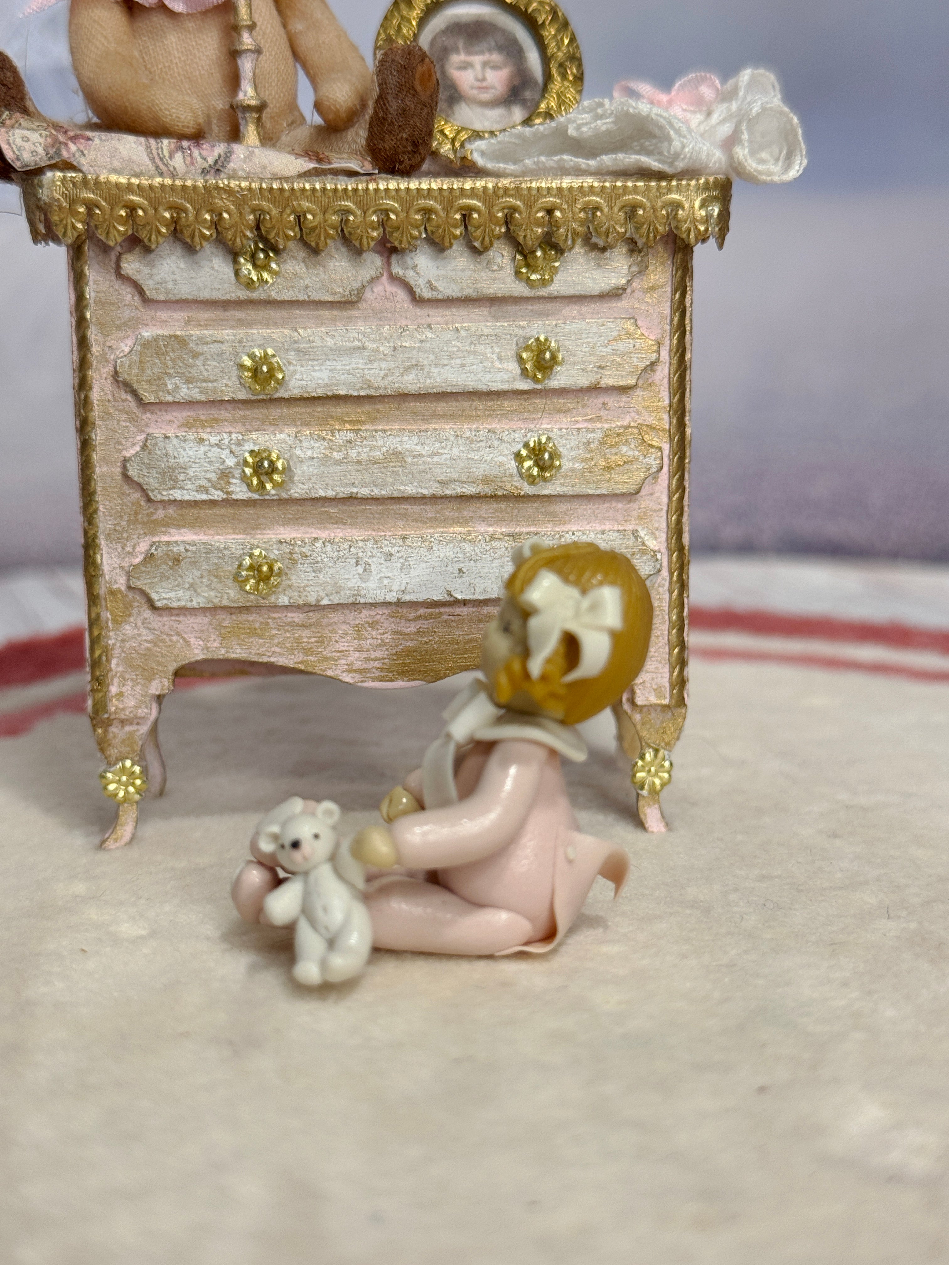 Sculpted Clay Baby Girl Doll in Pink Pajamas with Teddy Bear, side view