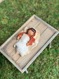 Load image into Gallery viewer, Signed Sculpted Clay Sleeping Native American Baby Doll Figurine, laying on a table, top view
