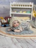 Load image into Gallery viewer, 1:6 Maree Massey Baby Girl RARE SIZE Dollhouse Doll Jointed Porcelain, laying on floor, left side
