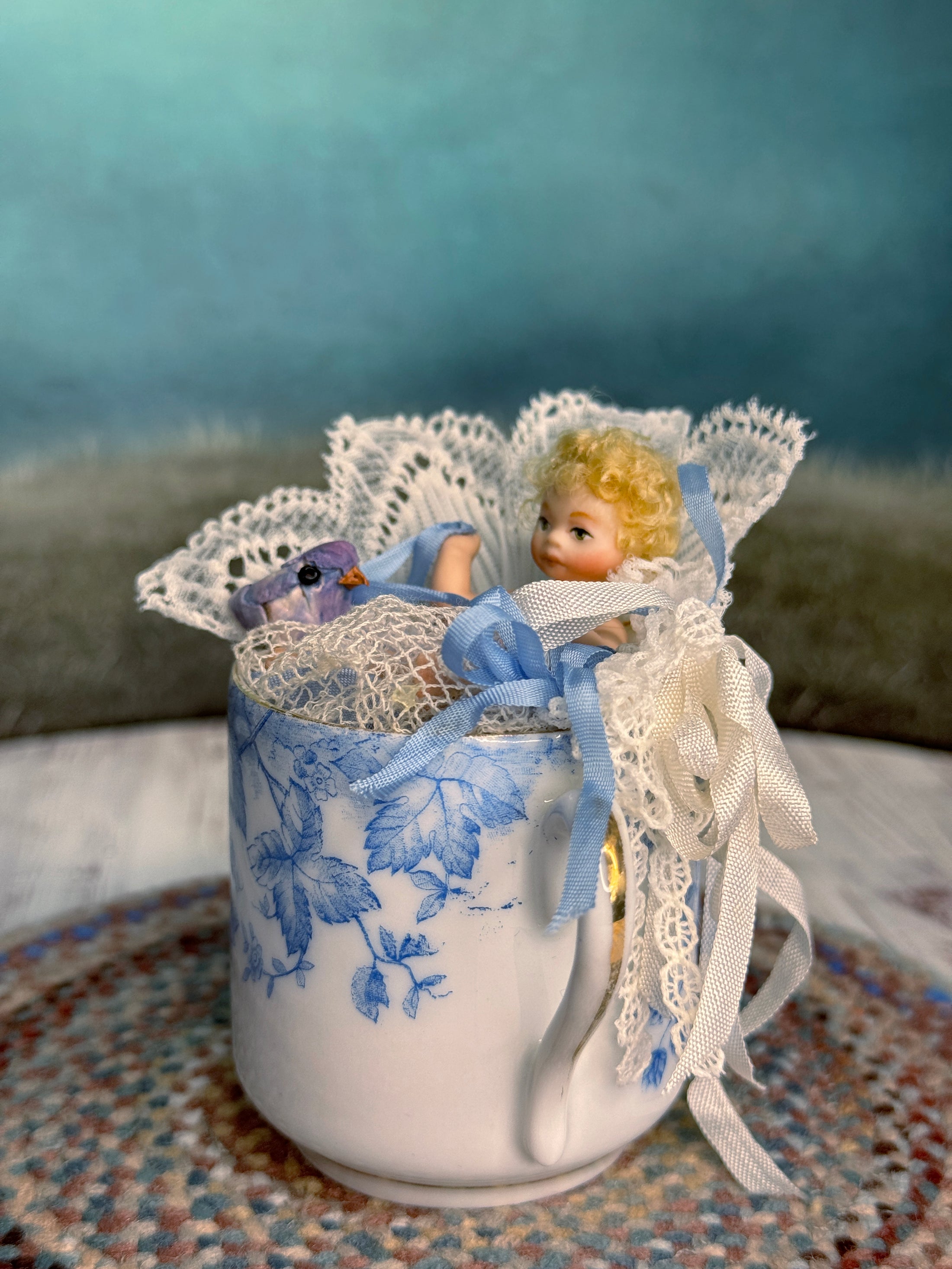 Tea Cup & Bluebird Diorama with Jointed Porcelain Baby Doll, left side view