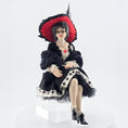 Load image into Gallery viewer, “Winter Lady” Doll with a black and white outfit and red hat on a white background
