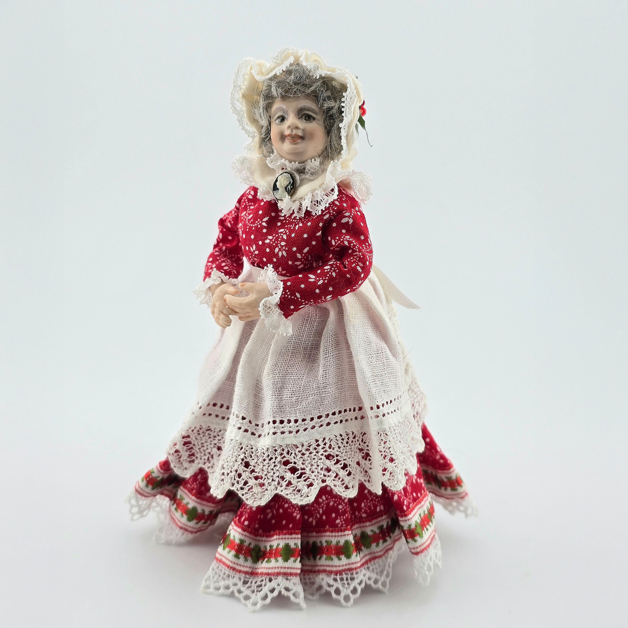 Mrs. Claus miniature doll on white background