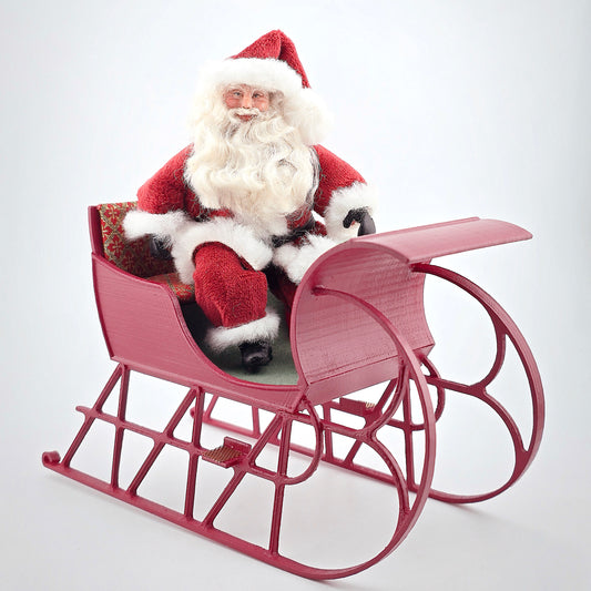 Santa dollhouse doll in his wooden christmas sleigh