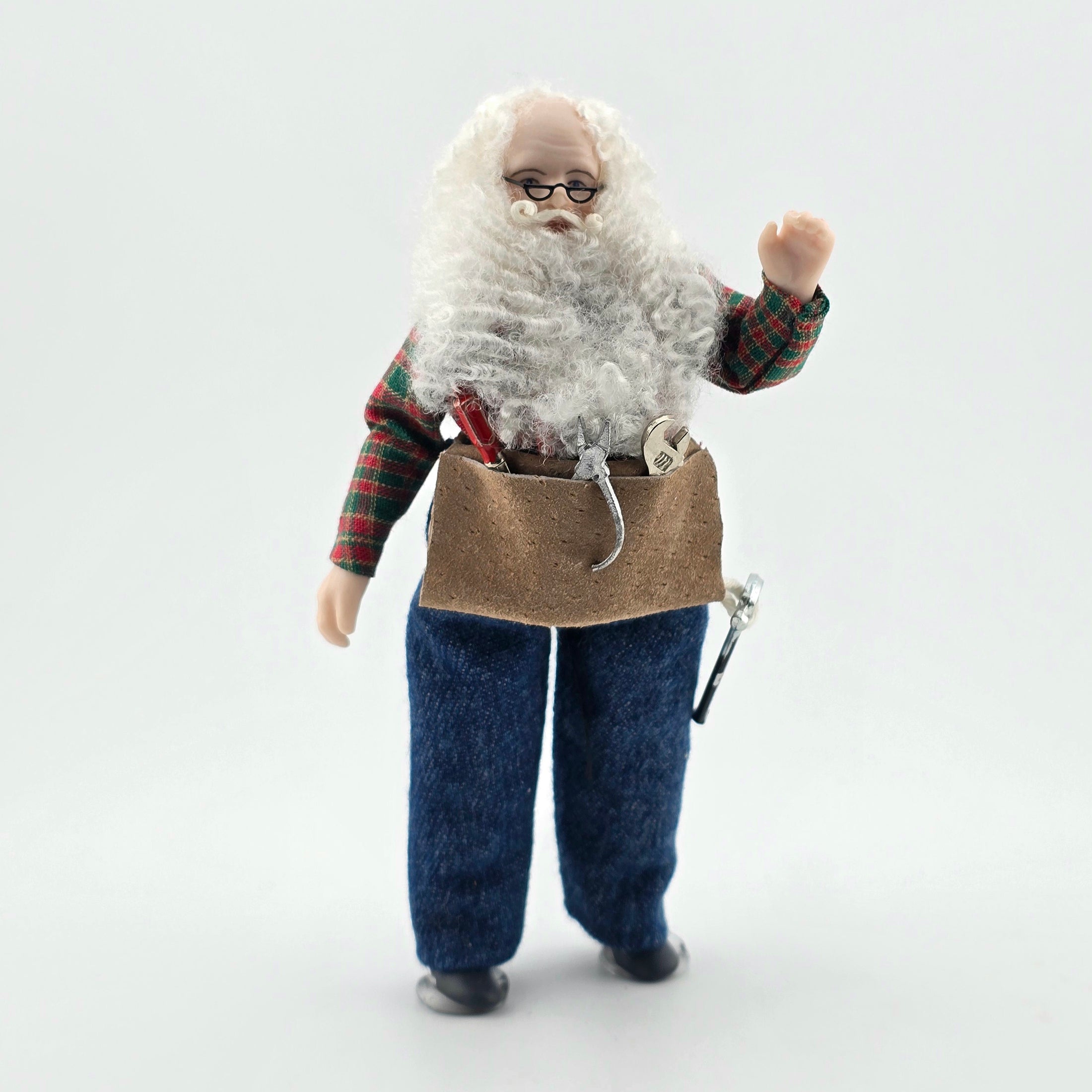 Dollhouse Doll Santa Claus with a long white beard and tool belt on a white background