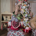 Load image into Gallery viewer, backside of elf doll with a Christmas tree and presents in the background
