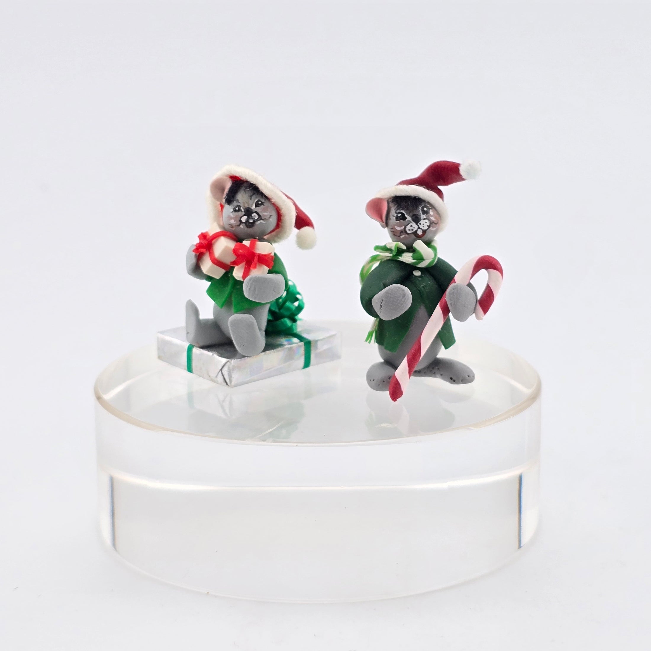 Two Christmas-themed Annalee style mice  figurines with a white background