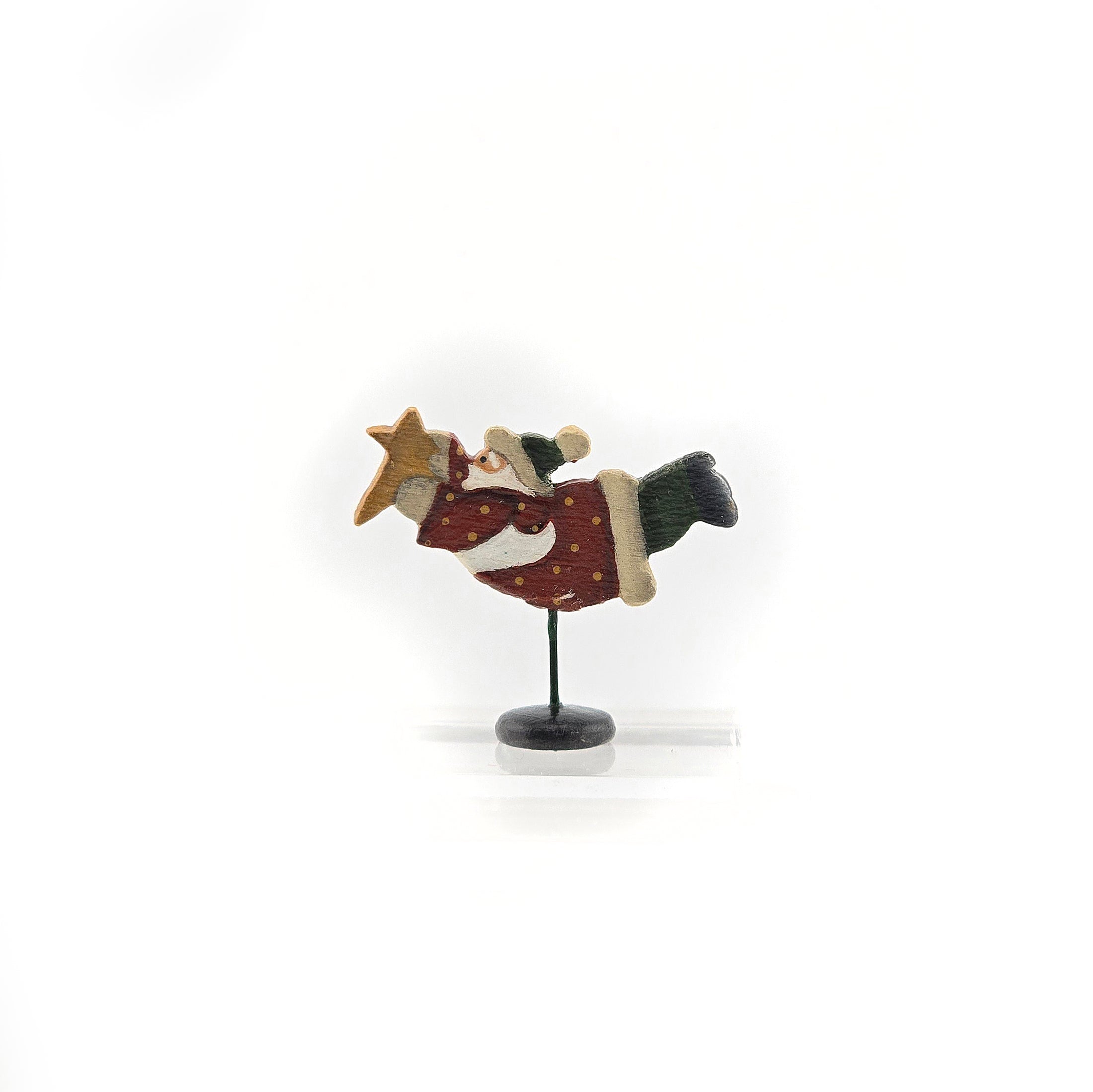 Decorative figure of a flying santa with a star on a white background