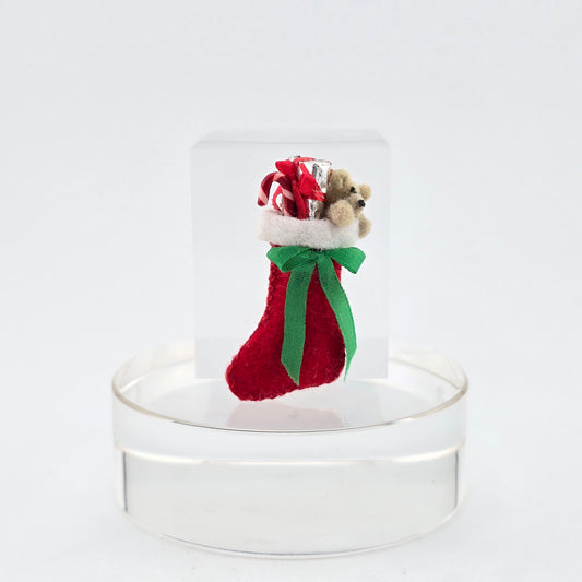miniature dollhouse stocking on a white background