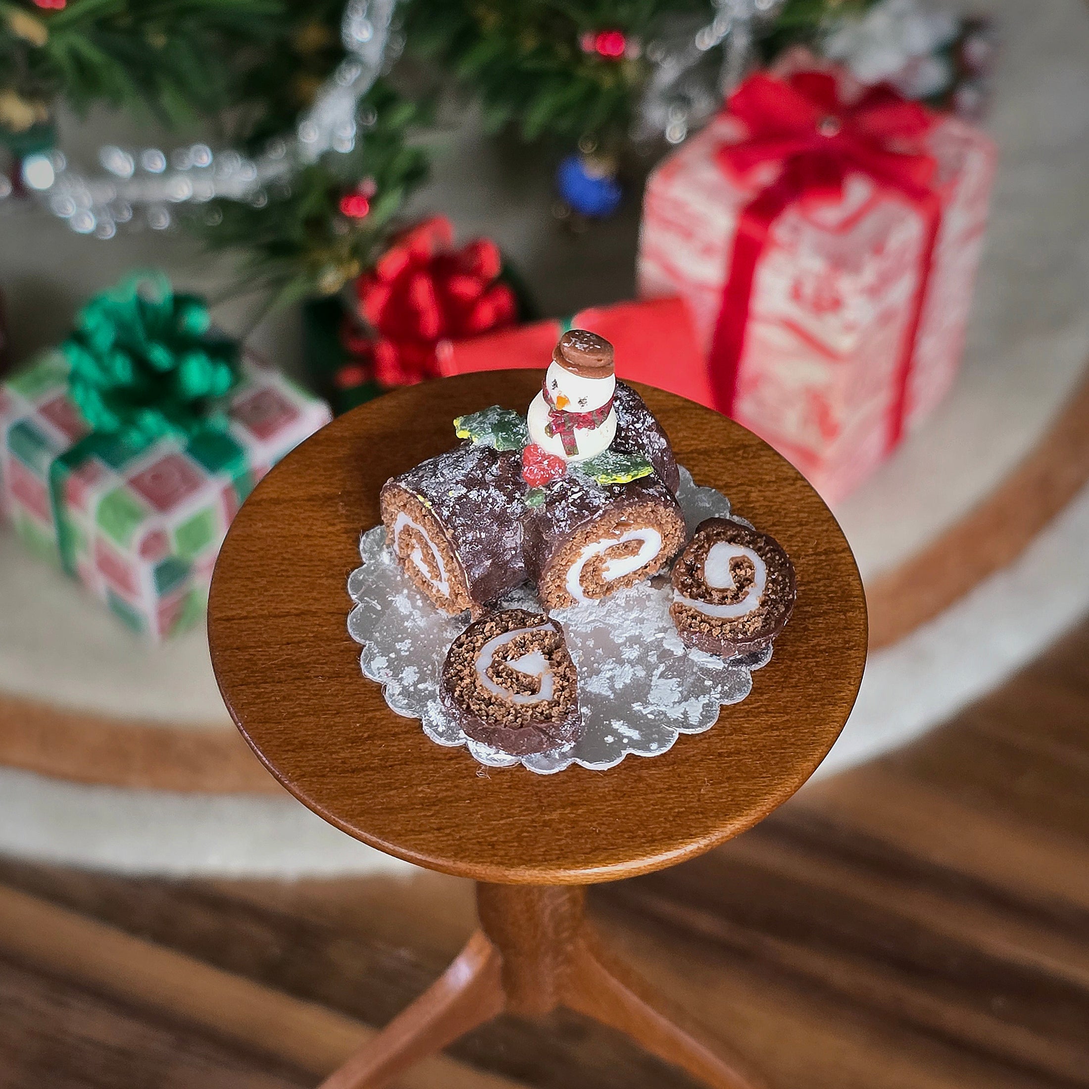 chocolate roll miniature cake with snowman on top