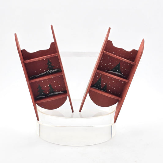 Wooden shelves with decorative Christmas scene on a white background