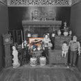 Load image into Gallery viewer, Black and white miniature room setup with furniture and decorative items.
