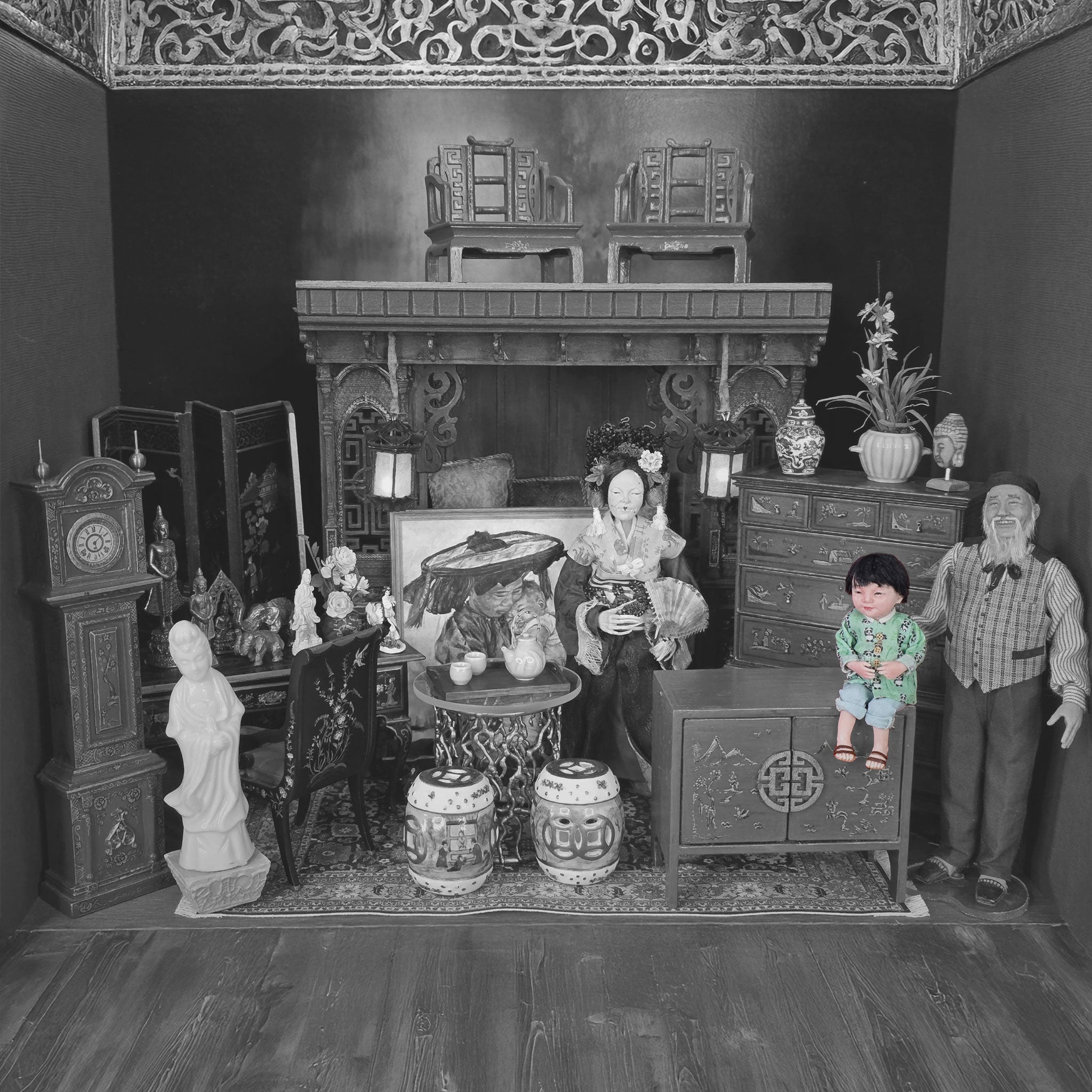 Vintage dollhouse with detailed furniture and figures in a room setting.
