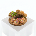 Load image into Gallery viewer, Assorted finger foods including a bowl of salad, bread slices with pickles, and pastries on a white background.
