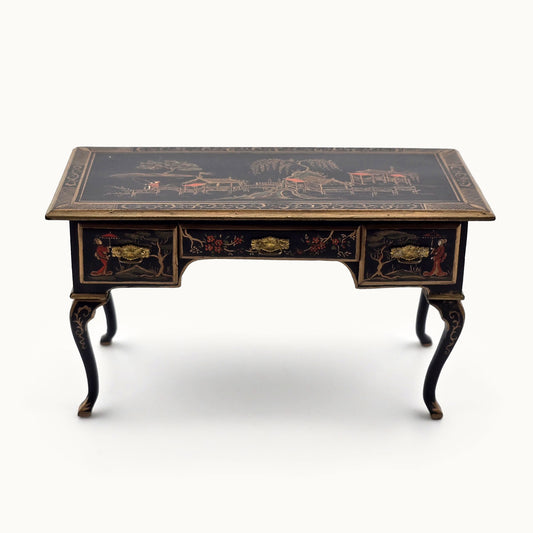 Decorative desk with intricate designs on a white background
