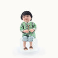 Load image into Gallery viewer, Miniature Chinese dollhouse character doll by Svetlana Blasing, wearing a green patterned panda shirt on a white background
