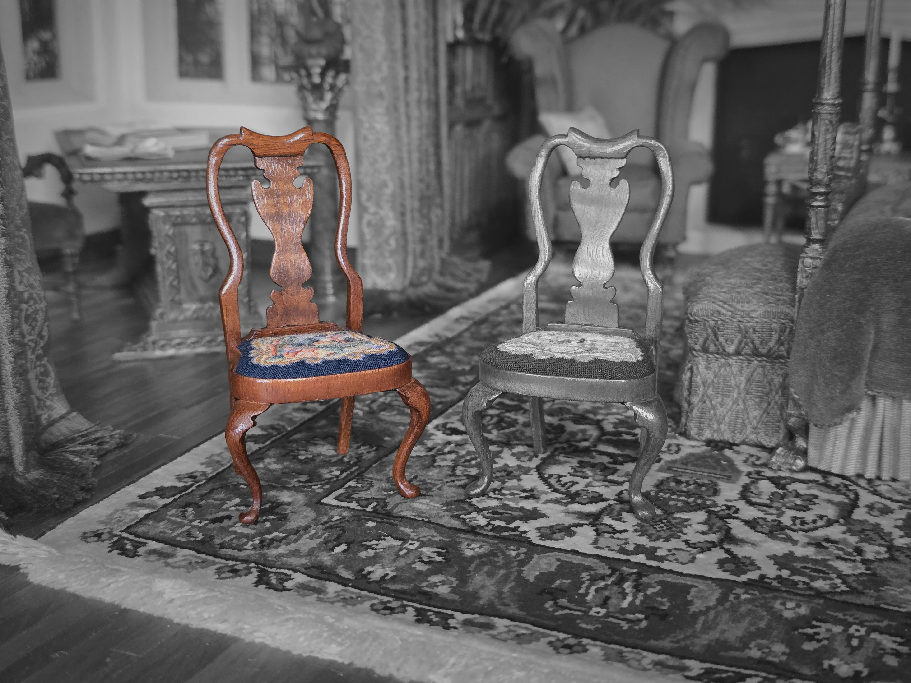 Two ornate chairs on a patterned rug in a room with decorative elements.