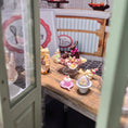 Load image into Gallery viewer, Paris Miniatures Chocolate Easter Rabbit Family Candy Display on Pink Glass Stand
