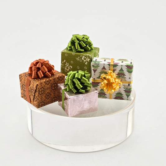 Decorative gift boxes with ribbons on a white surface