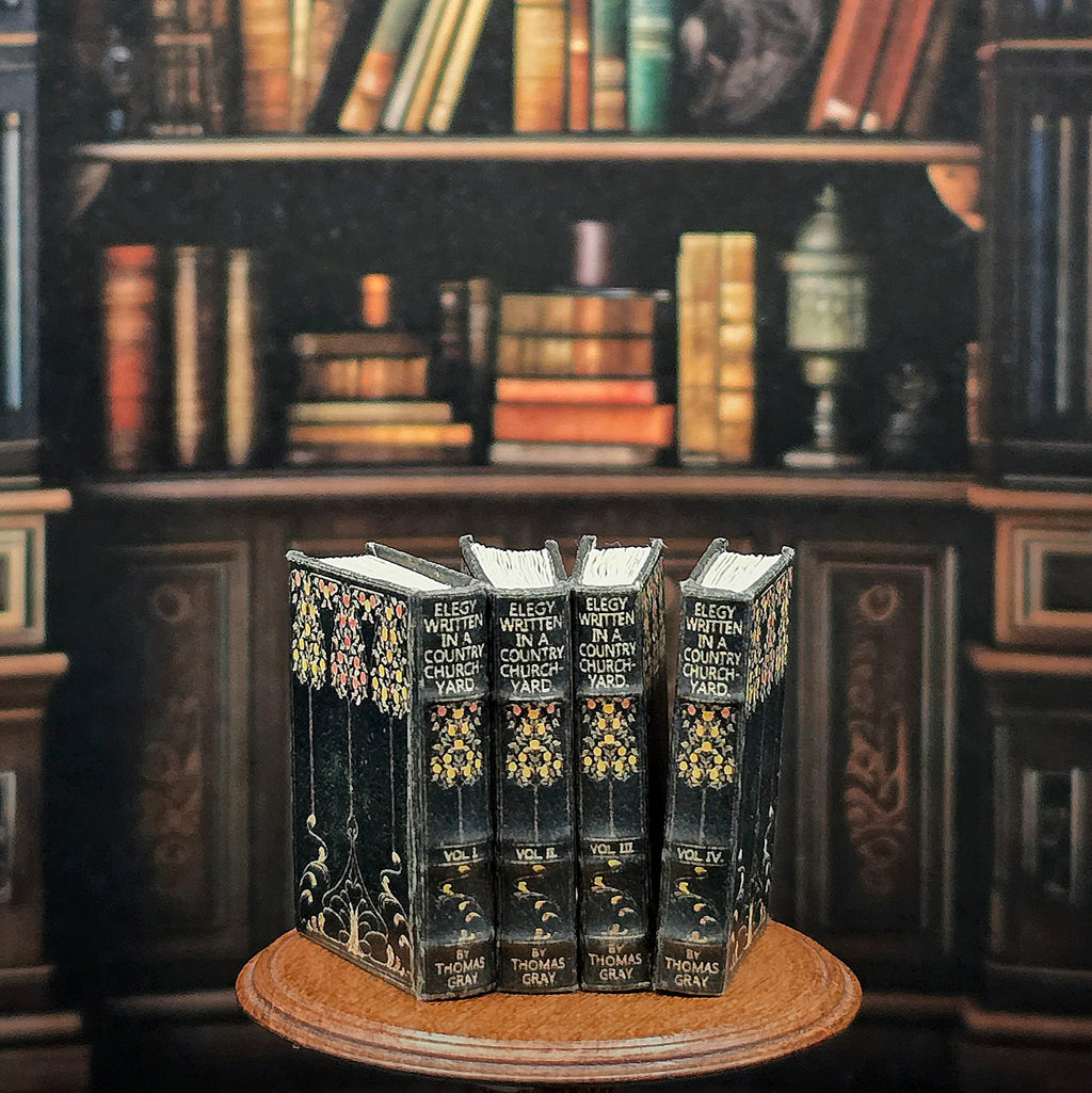 Decorative bookshelf with miniature books on a wooden stand against a blurred bookshelf background