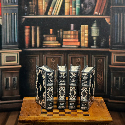 Decorative books on a wooden stand with a bookshelf background