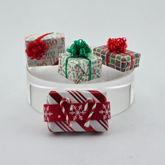group of miniature dollhouse wrapped Christmas gifts