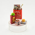 Load image into Gallery viewer, collection of small gifts and a teddy bear on a white surface with a white background
