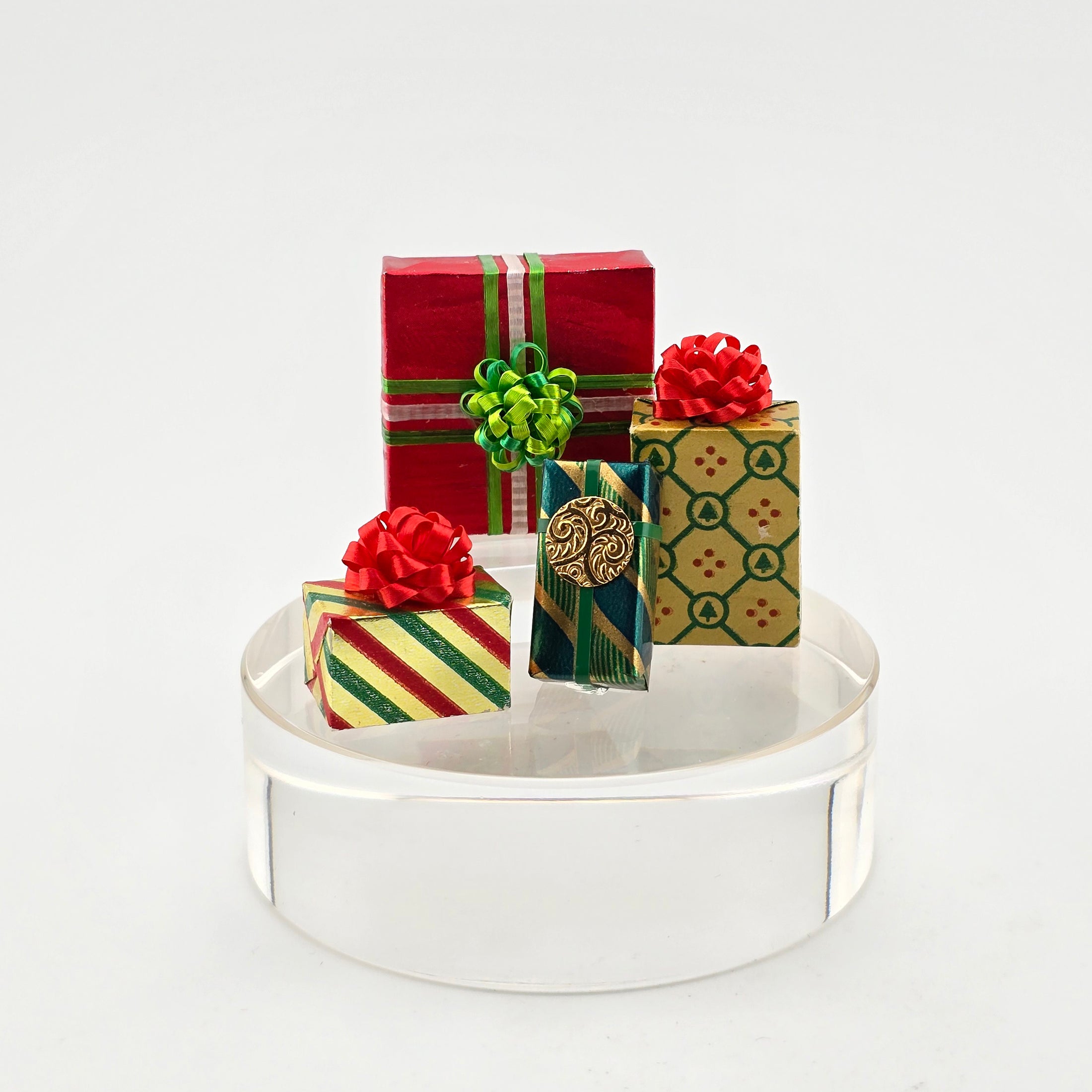 Dollhouse miniature Decorative gift box set with colorful ribbons on a white background