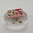 Load image into Gallery viewer, Miniature Christmas scene with cups, cookies, and a box on a white surface
