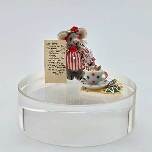 Decorative scene with a small teddy mouse, teacup, and letter on a clear base.