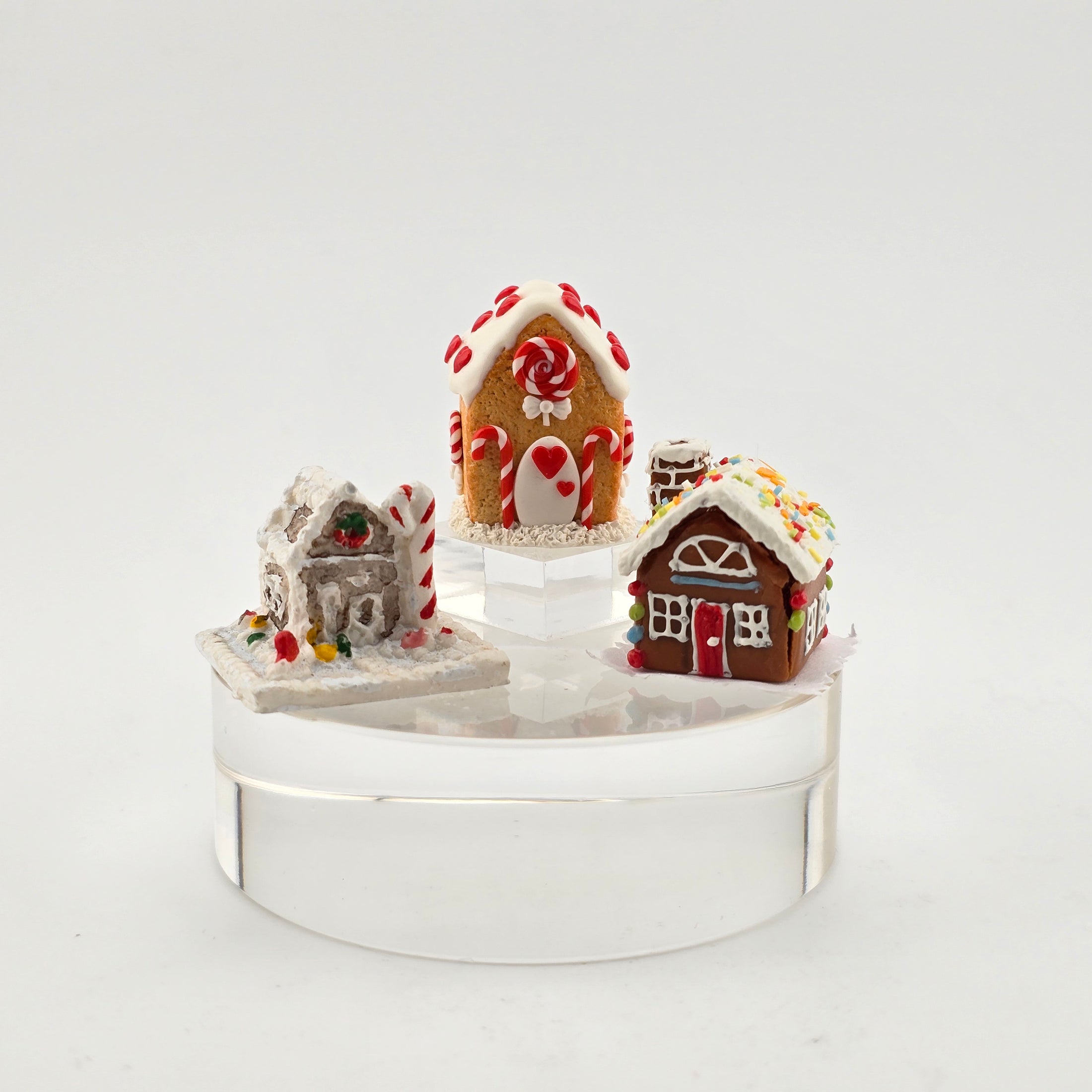 Set of miniature gingerbread houses on a white background