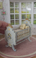 Load and play video in Gallery viewer, Painted Baby Blue Antique-Style Cradle Dressed with Silk Bedding Bluette Meloney
