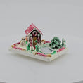 Load and play video in Gallery viewer, video of gingerbread house on white background
