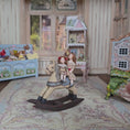 Load and play video in Gallery viewer, Almudena Gonzalez Two Victorian Little Girl Dolly's Riding a Wooden Rocking Horse
