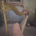 Load and play video in Gallery viewer, Janet Reyburn Miniature Cherubic Harp Artisan Dollhouse Musical Instrument
