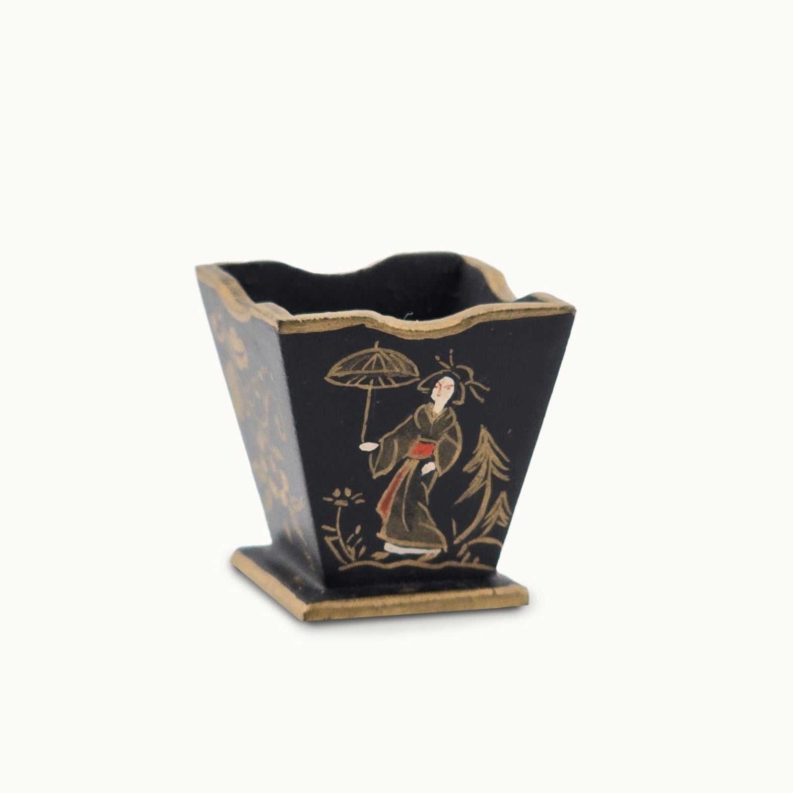 Decorative black waste basket with gold and white design on a white background