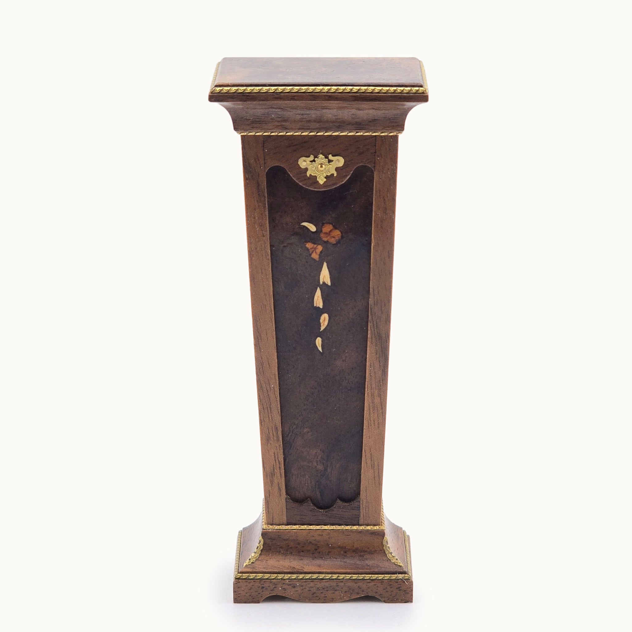 Wooden pedestal with decorative elements on a white background