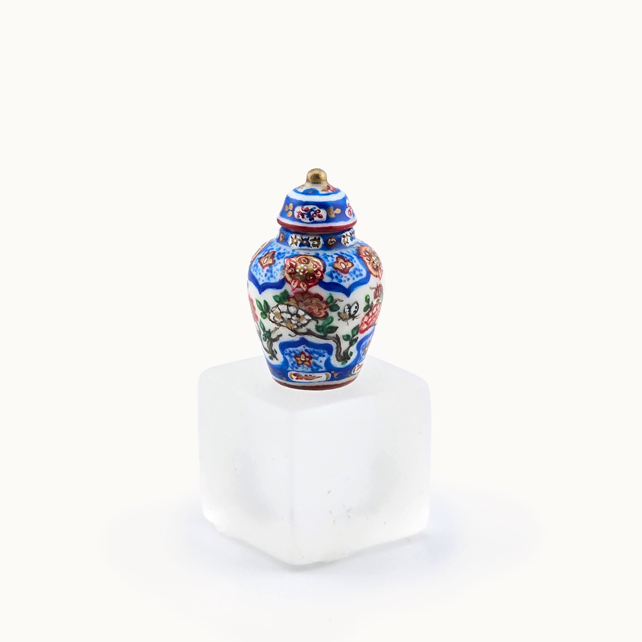Decorative ceramic jar with floral patterns on a white background