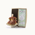Load image into Gallery viewer, Small doll in a brown dress with a box labeled 'Dave Pennant Fine Antique Dolls' on a white background
